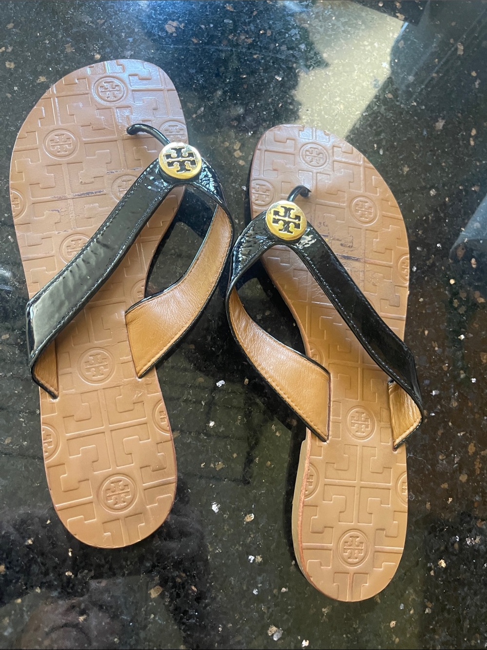 Tory Burch thongs . Black with gold logo detail. EUC